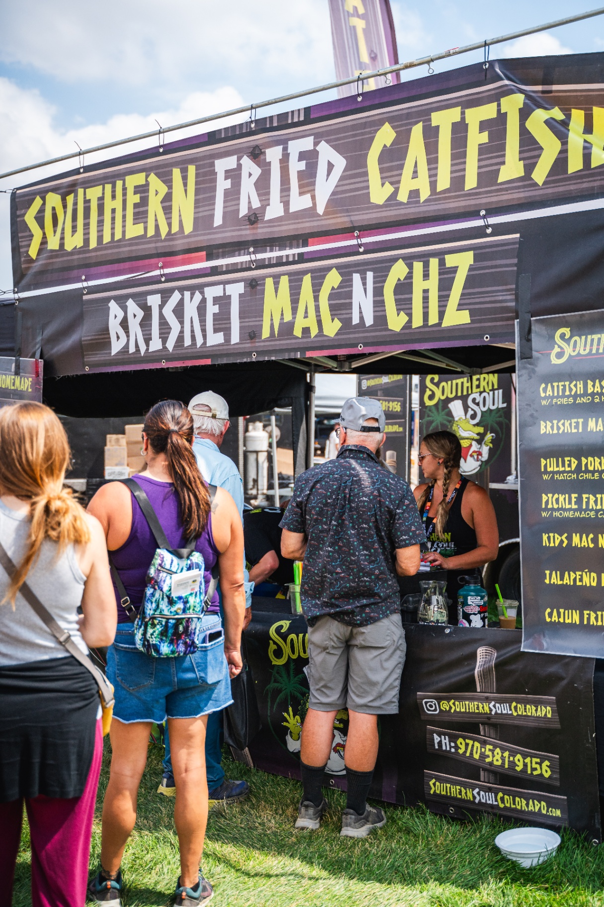 Guests lined up at the Southern Soul booth under the Southern Fried Catfish banner